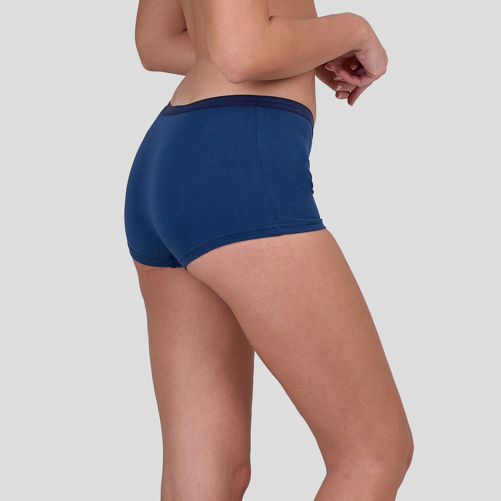 Person wearing a Dice blue underwear on a gray background