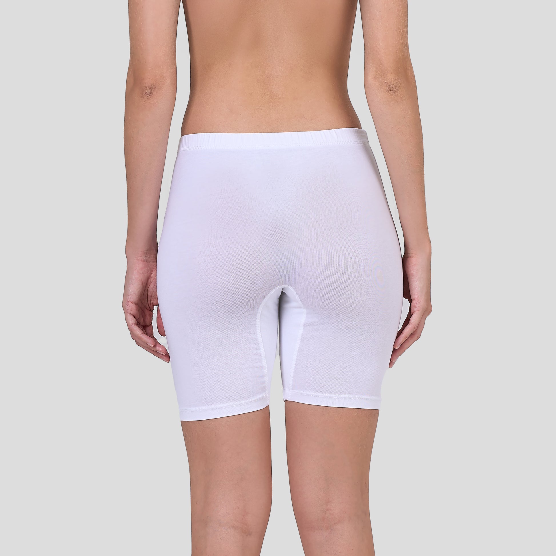 Dice White shapewear shorts worn by a person on a plain background