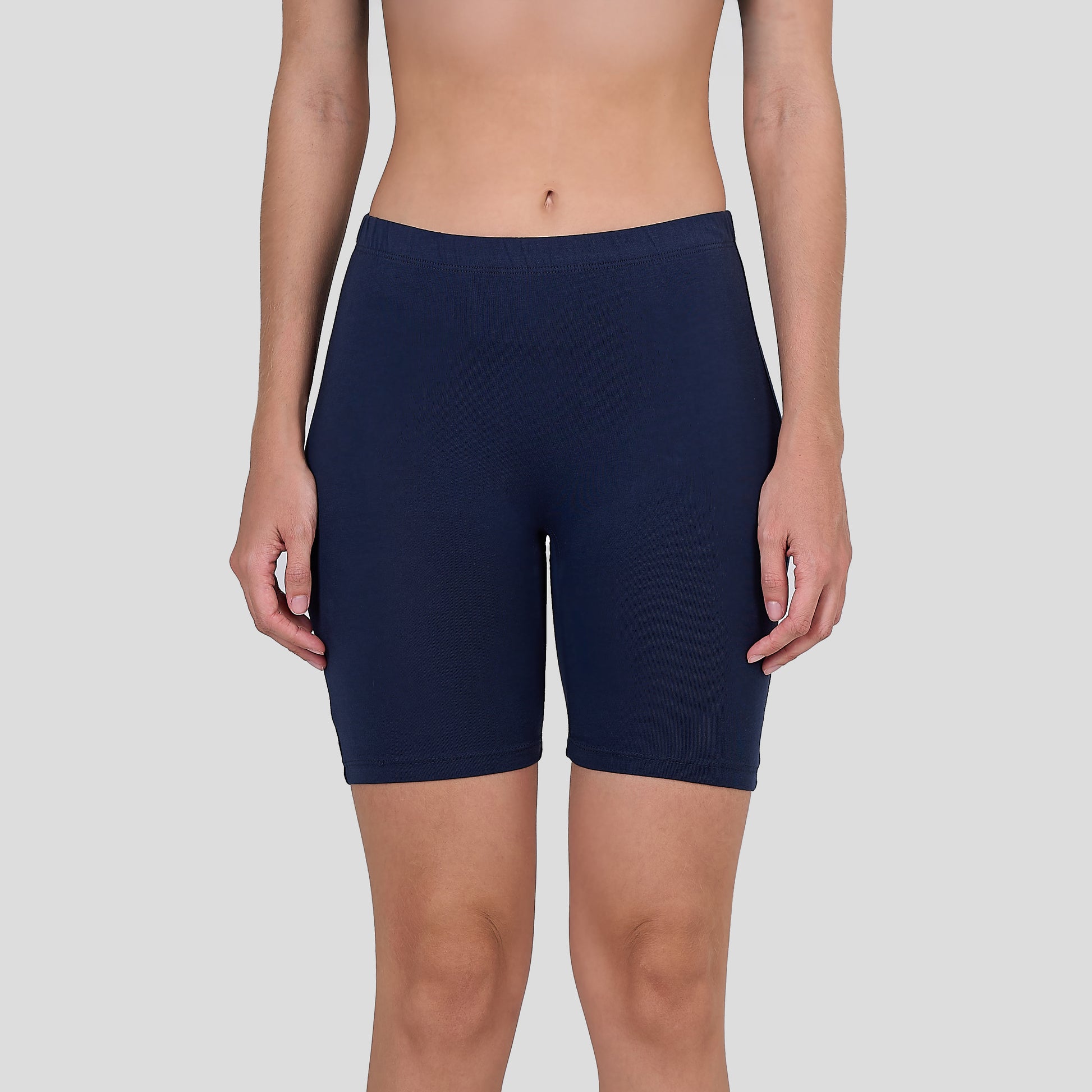 Dice Navy blue athletic shorts worn by a person on a light gray background
