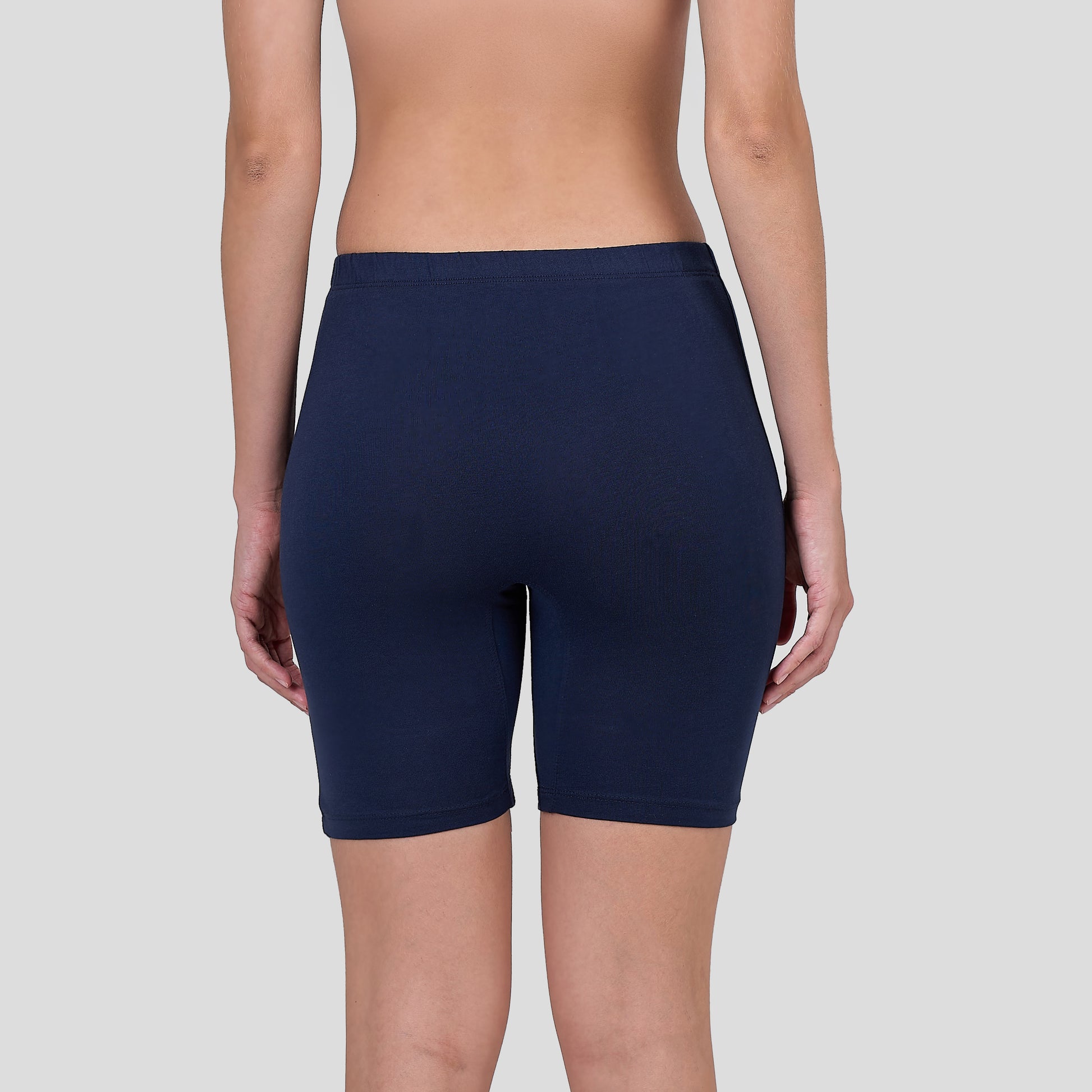 Dice Navy blue athletic shorts worn by a person on a light gray background