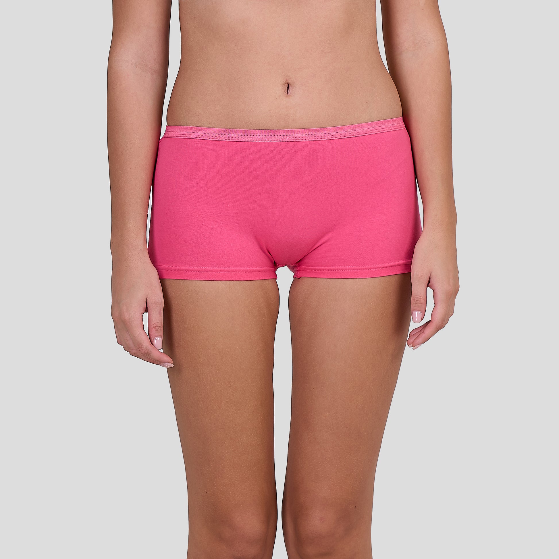 Person wearing a Dice bright pink underwear on a plain background