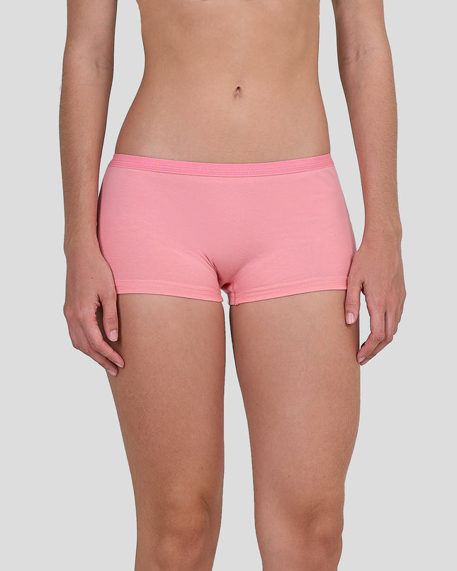 Person wearing a Dice pink shorts on a plain background