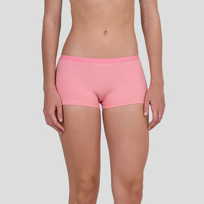 Person wearing a Dice pink shorts on a plain background