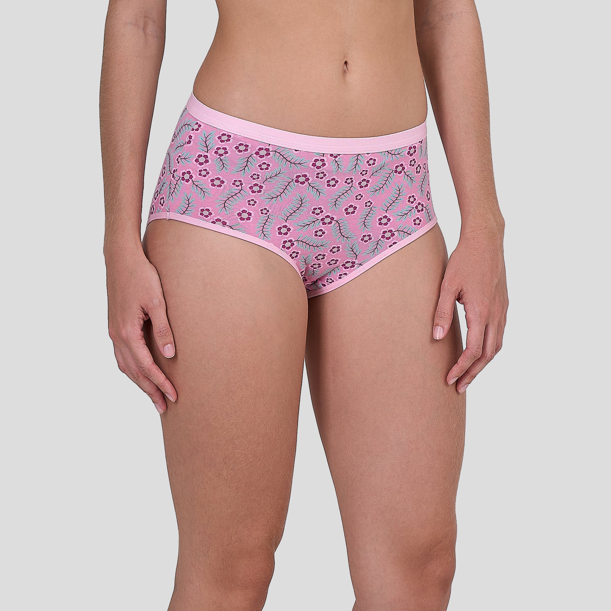Dice Pink floral-patterned underwear worn by a person on a light gray background