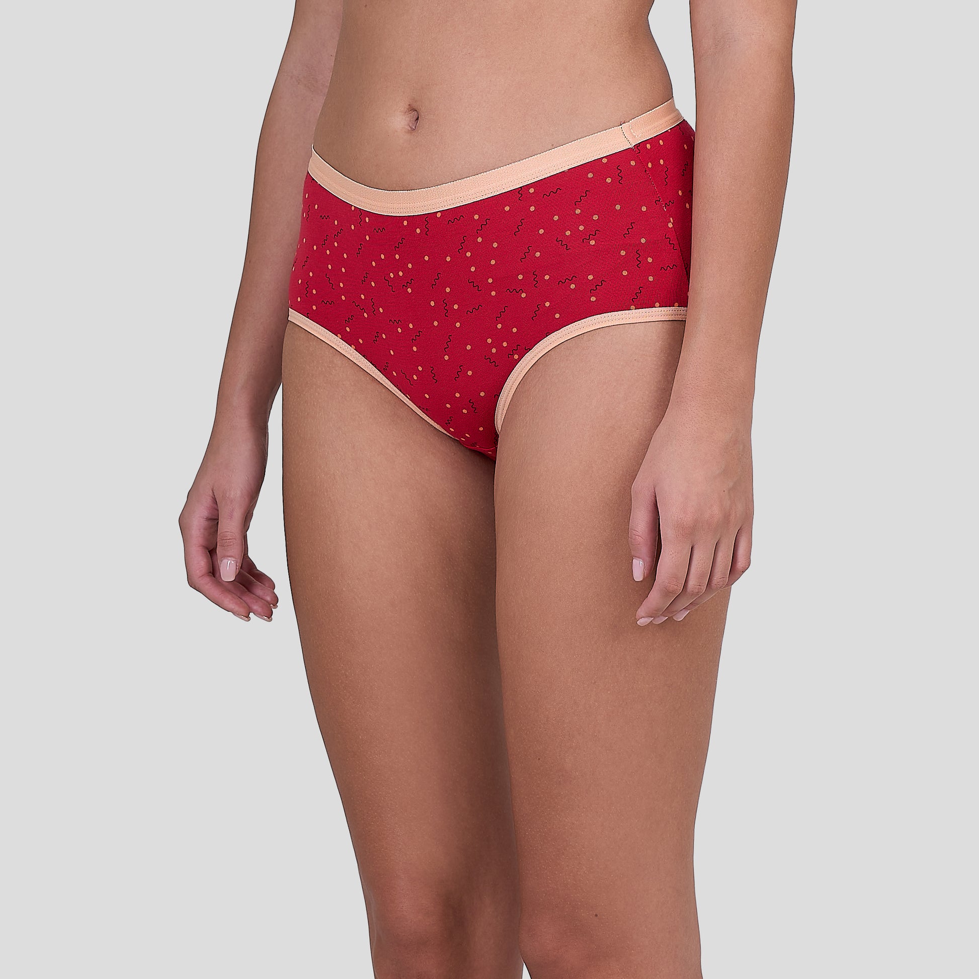 Dice Red patterned underwear worn by a person on a light gray background