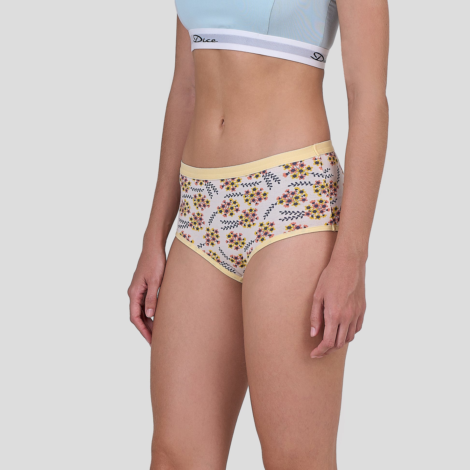 Dice Floral-patterned underwear worn by a person on a plain background