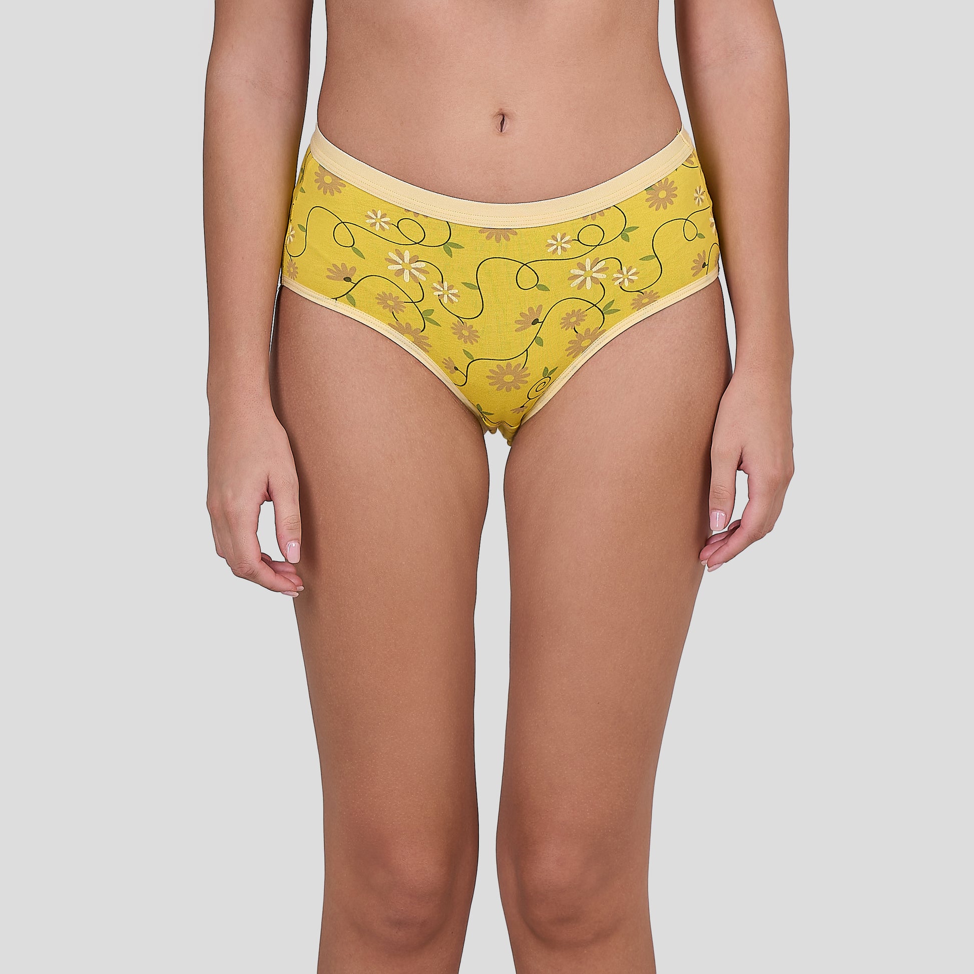 Dice Yellow patterned underwear worn by a person on a plain background
