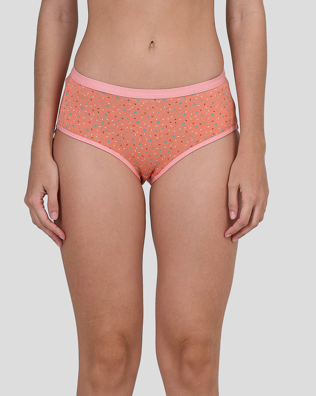 Person wearing a Dice coral patterned underwear on a plain background