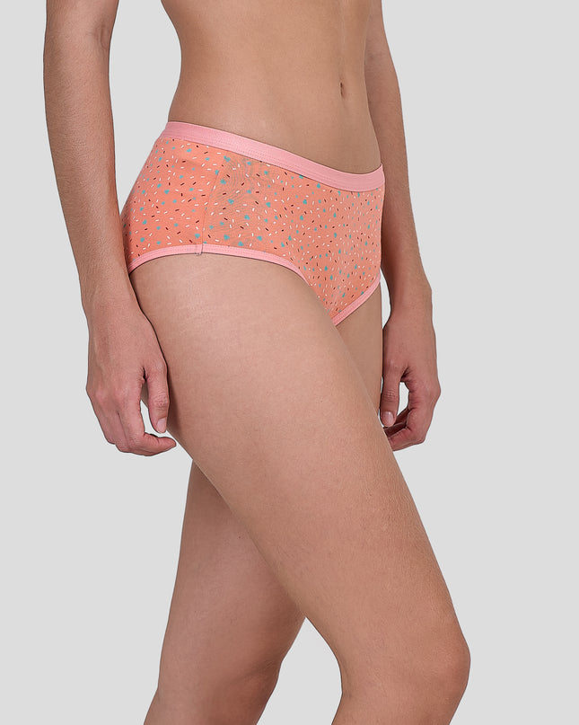 Person wearing a Dice patterned pink underwear on a plain background