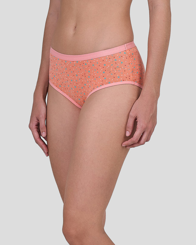 Person wearing a Dice patterned orange underwear on a plain background