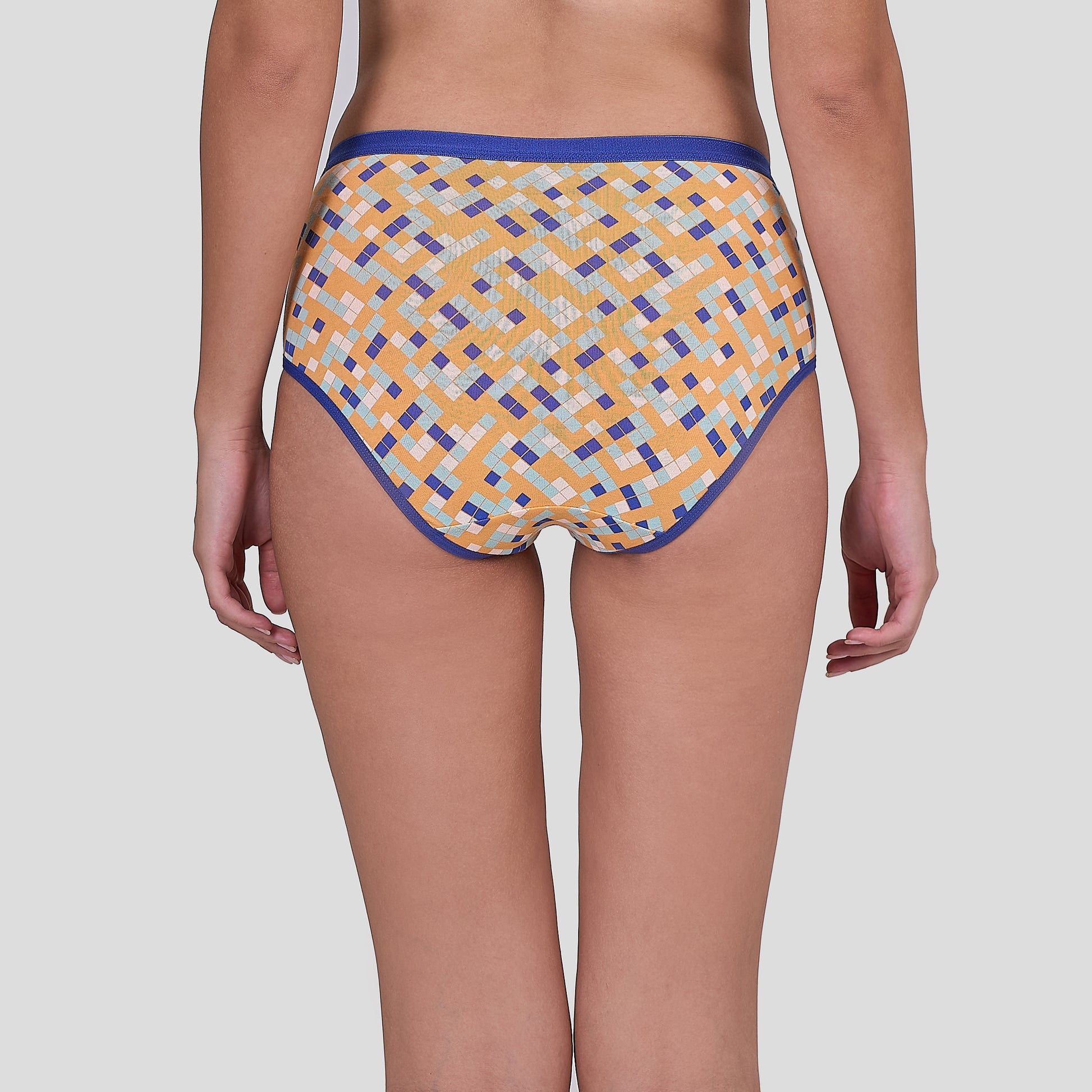 Dice Patterned underwear worn by a person on a plain background