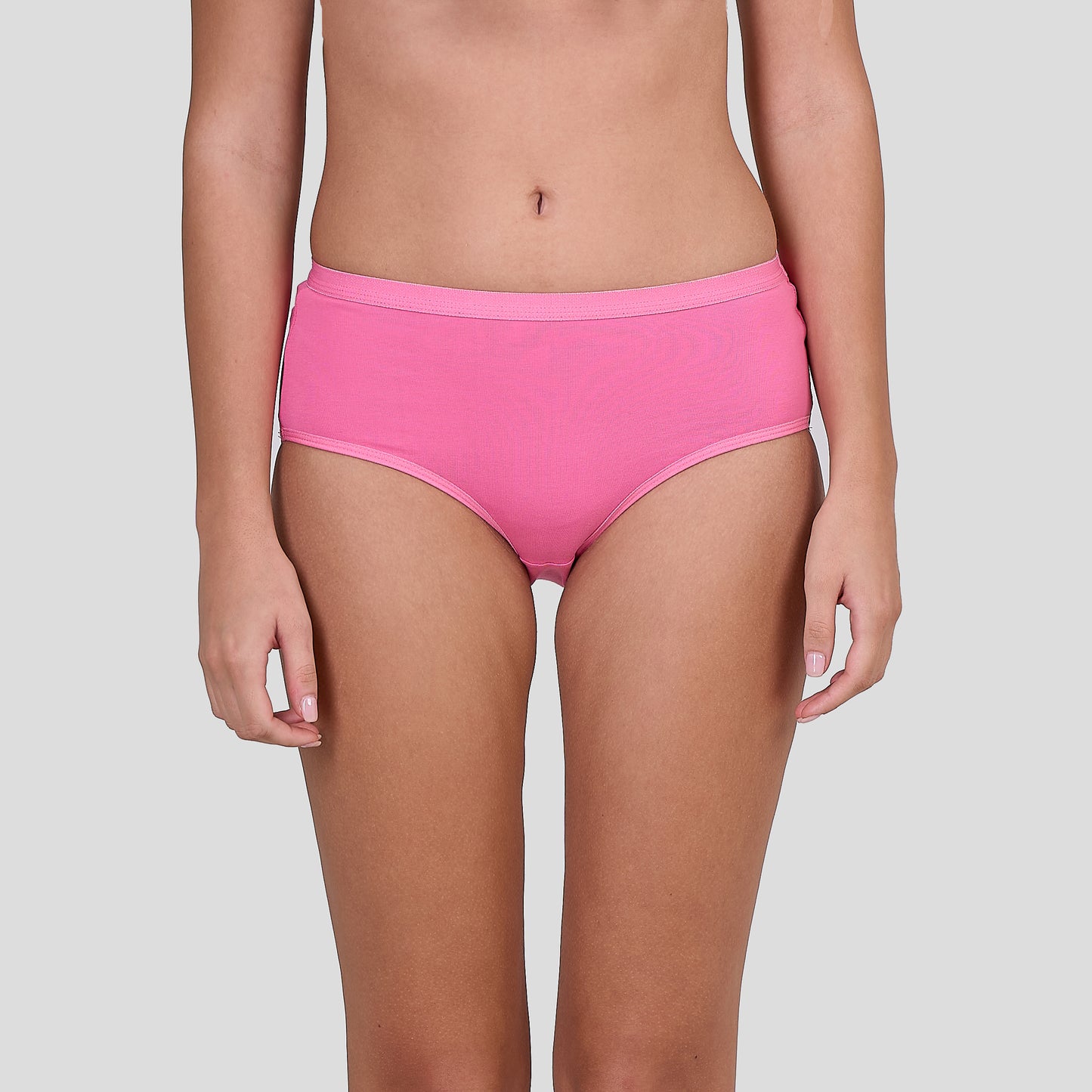 Person wearing Dice bright pink high-waisted bikini bottoms on a plain background