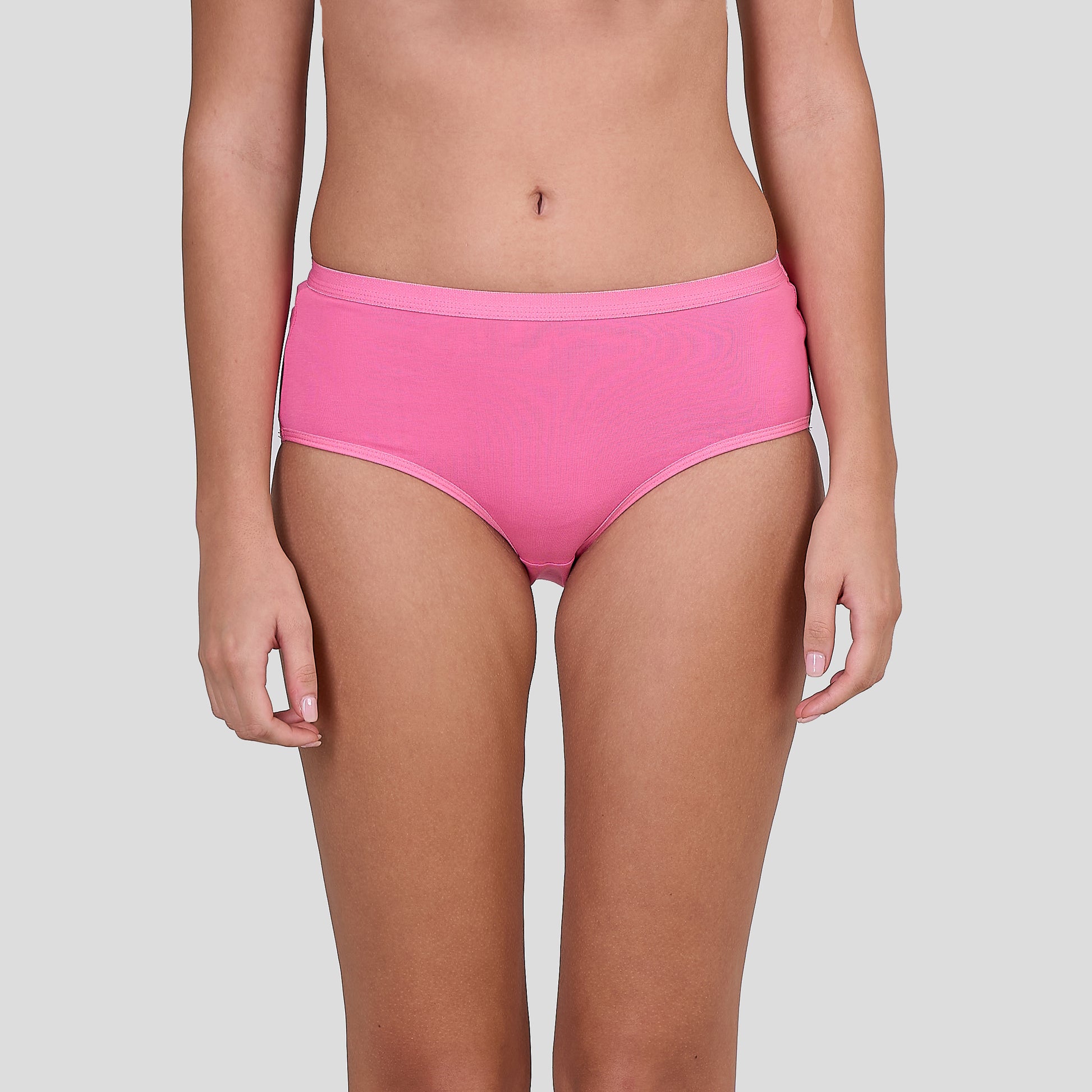 Person wearing Dice bright pink high-waisted bikini bottoms on a plain background