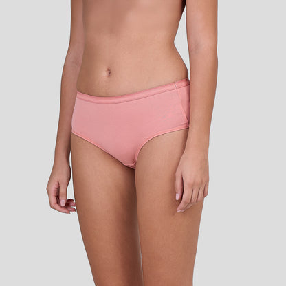 Person wearing a Dice pink bikini bottom on a light gray background