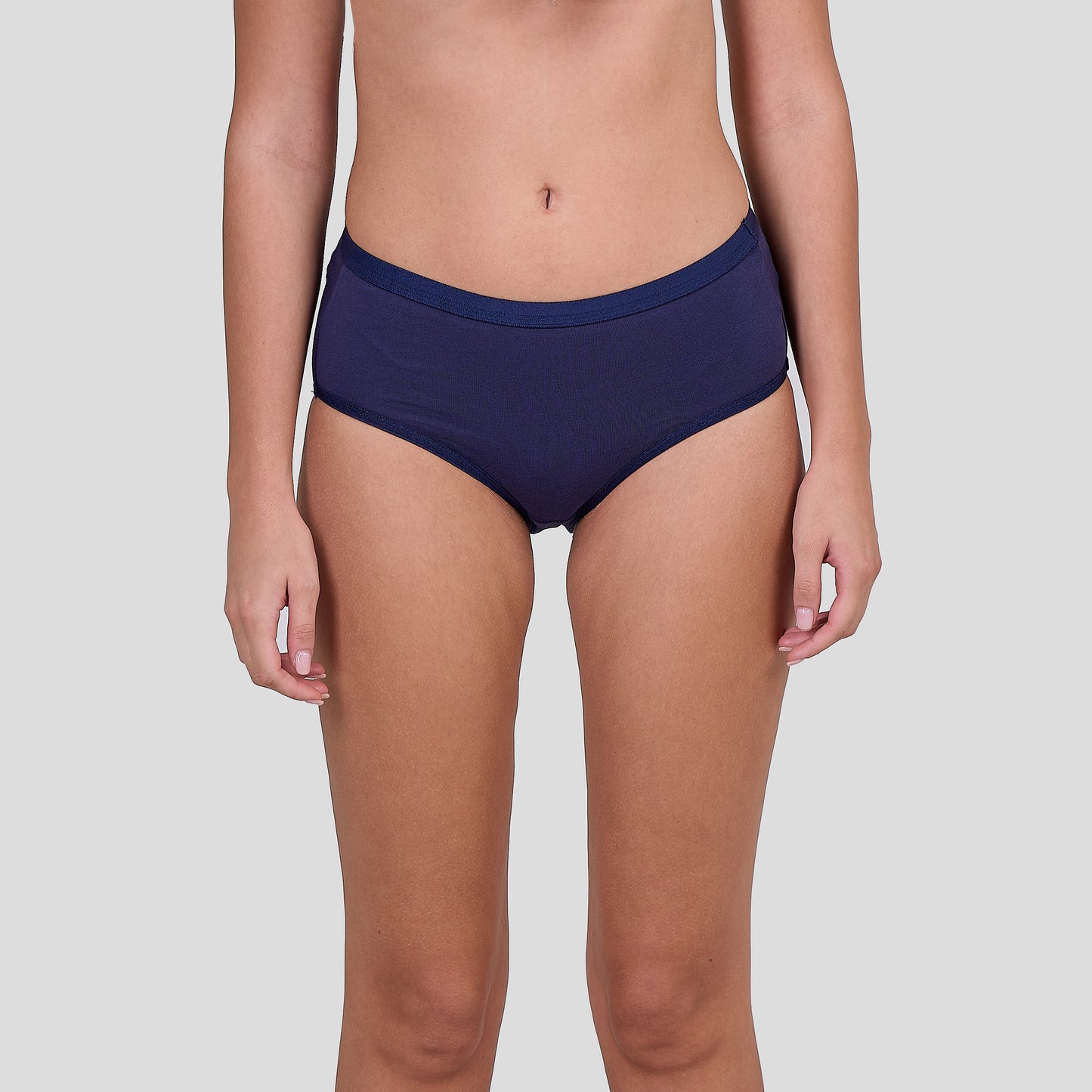Person wearing Dice navy blue underwear on a light gray background