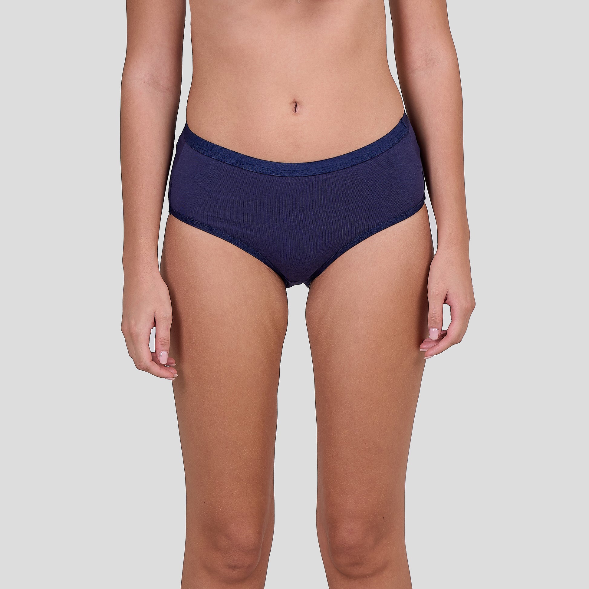 Person wearing Dice navy blue underwear on a light gray background