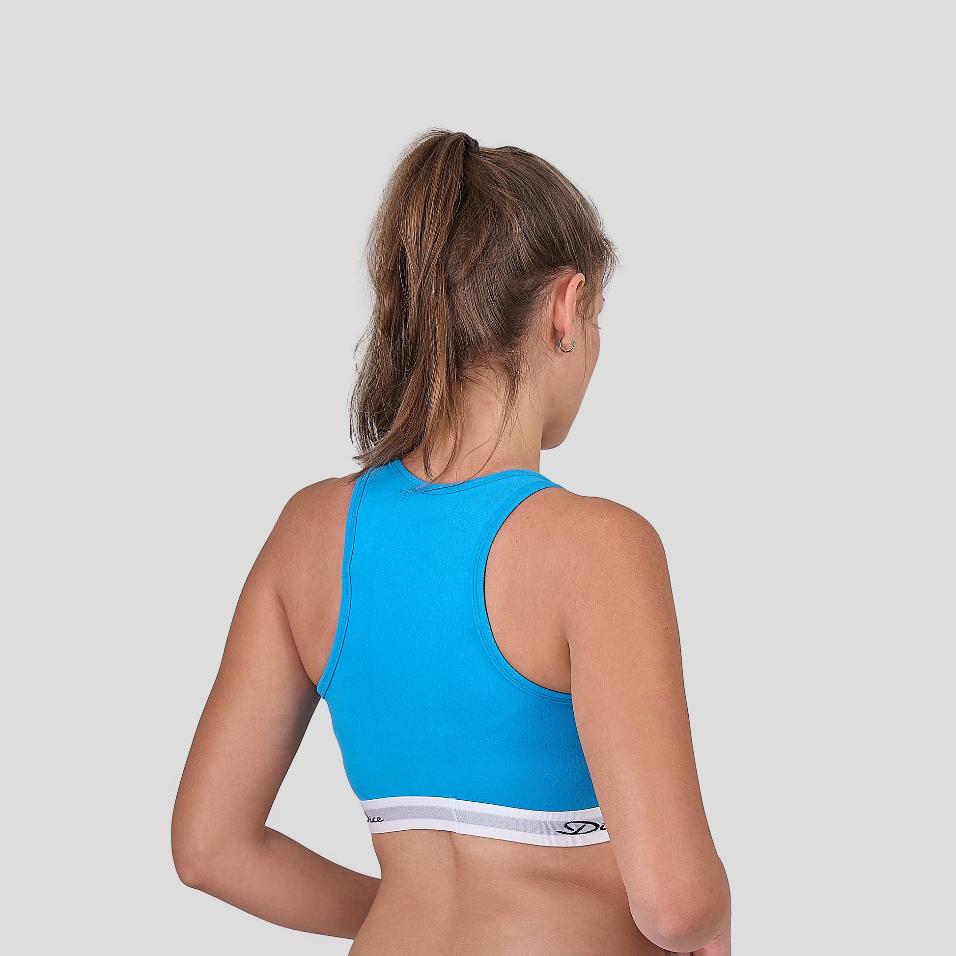 Dice blue sports bra on a plain background