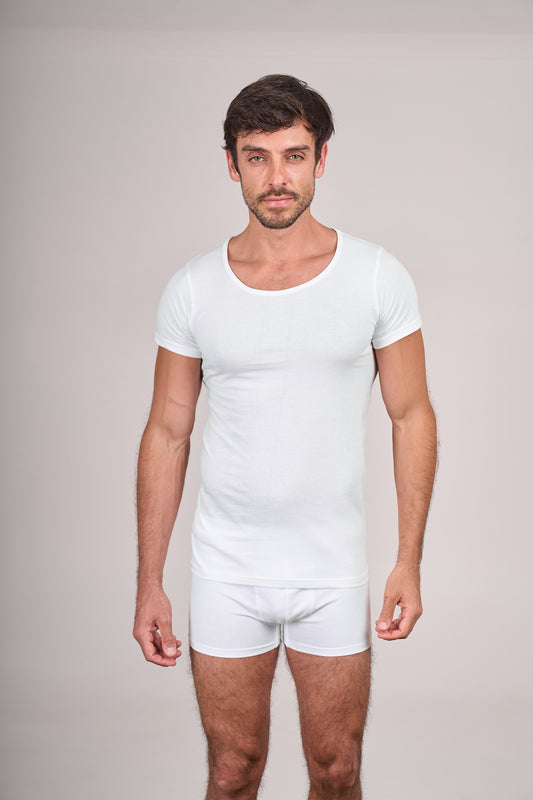 Man wearing Dice white t-shirt and underwear set against a plain background