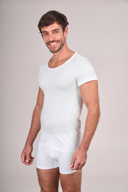 Man wearing Dice white t-shirt and shorts on a plain background