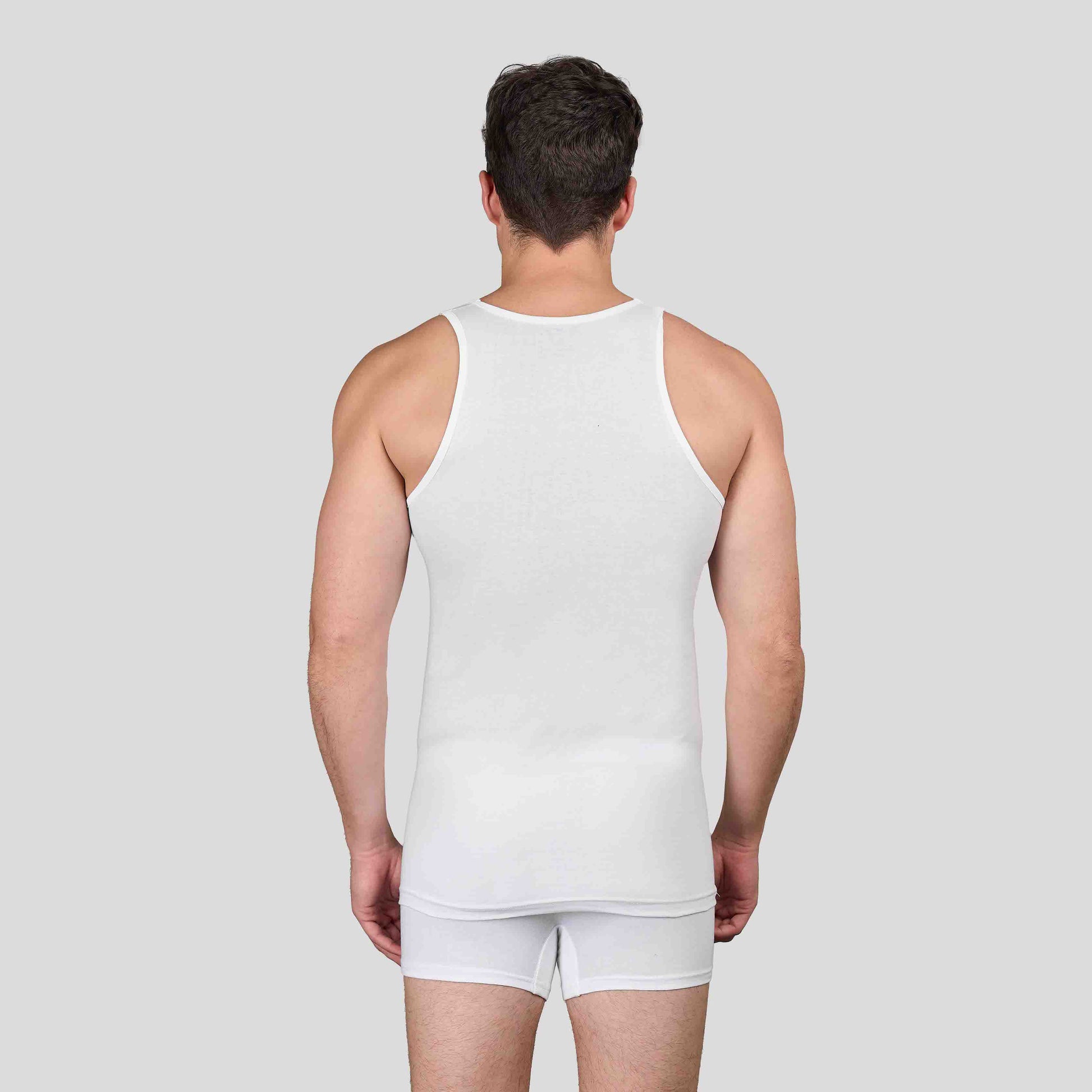 Man wearing Dice white tank top and underwear set on a plain background