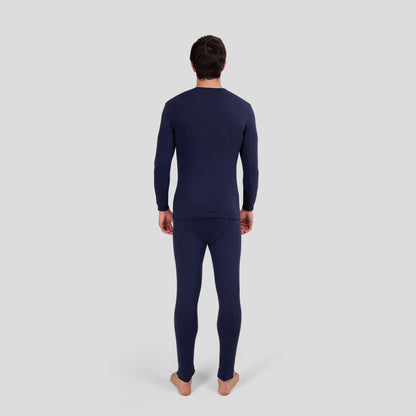Man wearing Dice navy long-sleeve and long-bottomed thermal underwear set on a light gray background