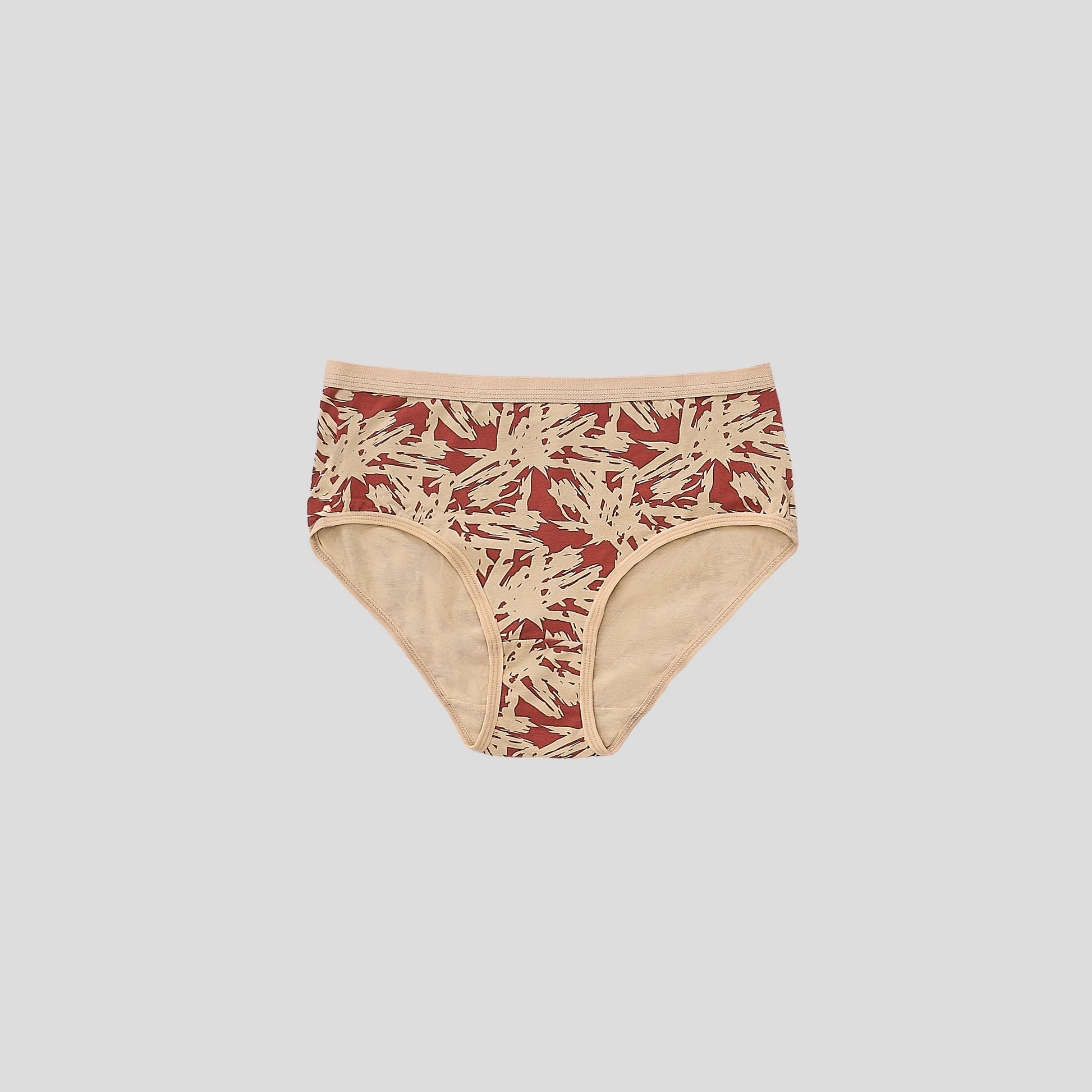 Dice Beige and red patterned underwear on a light gray background